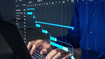 Person typing on laptop with Gantt chart overlay.