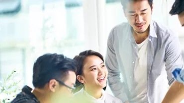 Group of people collaborating at a bright office.